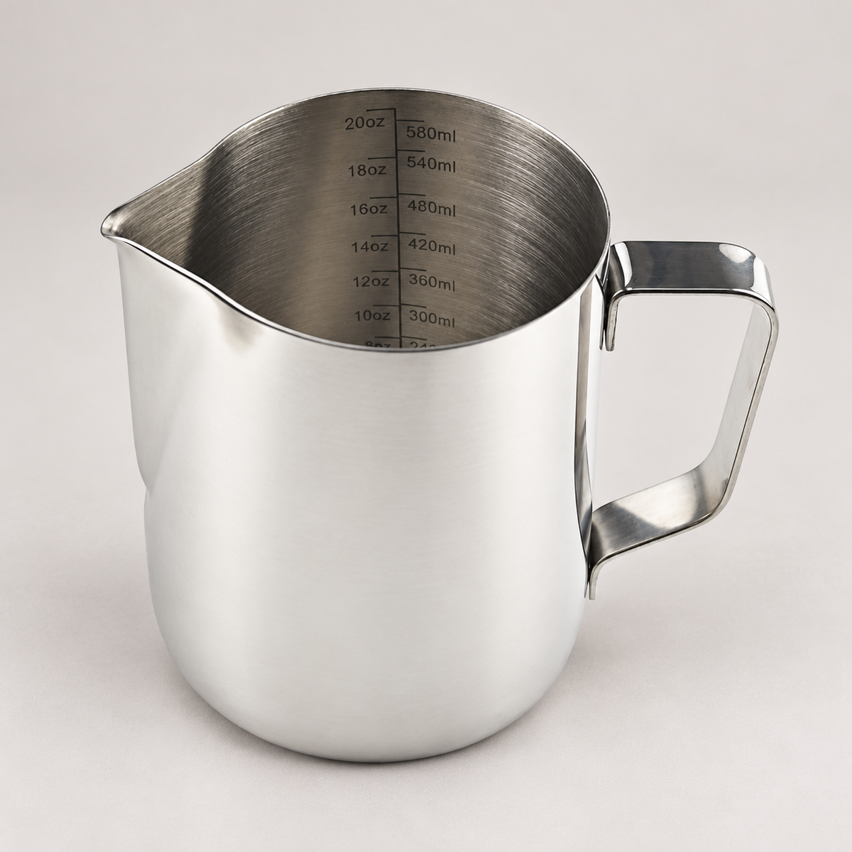 600ml stainless steel barista milk frothing jug — warm grey background