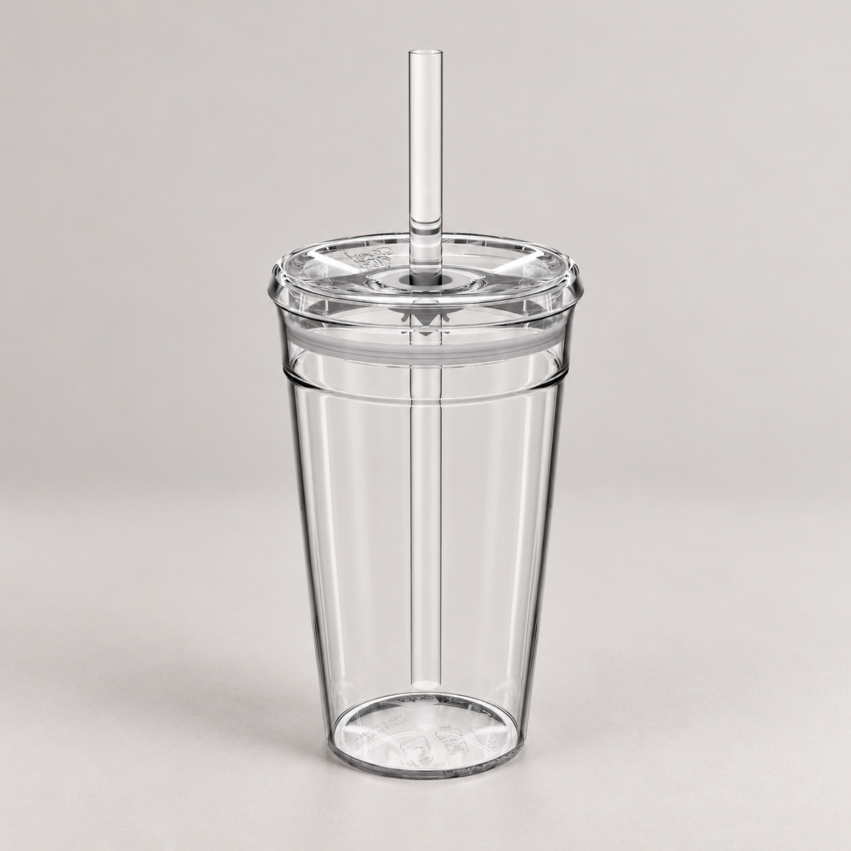 Bean & Gone Reusable Iced Coffee Cup — Clear 16oz with Hard Plastic Straw on a warm grey background